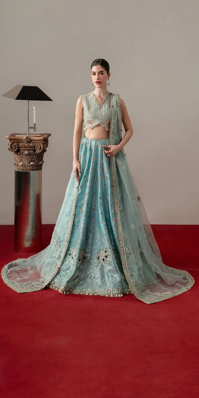 Aqua bridal lehenga with embroidered sleeveless choli and long net dupatta