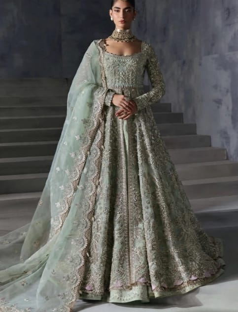 Mint green bridal gown with heavy silver embroidery and a sheer embroidered dupatta