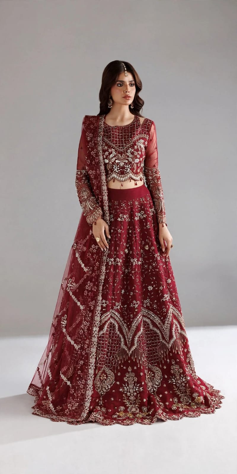 Red bridal lehenga with silver and gold embroidery and matching dupatta